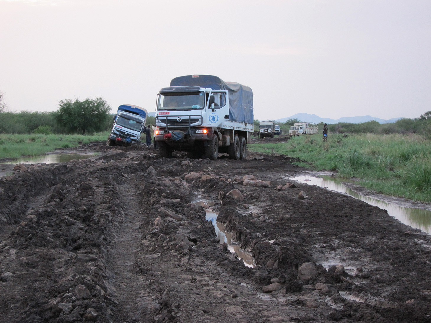 Trucks on dirt road